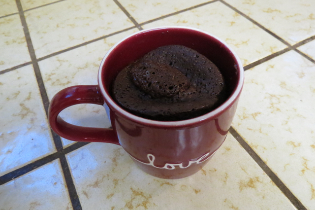 Cup of baked chocolate cake, right out of the microwave