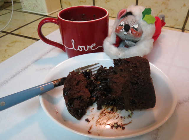 Little stocking mouse is ready for fresh chocolate cake
